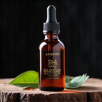Amber glass bottle of natural beard oil with droppe, on a rustic wooden surface.